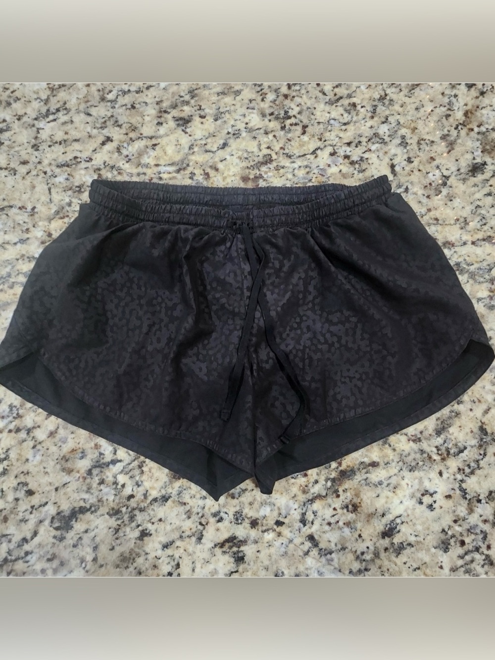 Old Navy Active running shorts featuring a black-on-black leopard print design